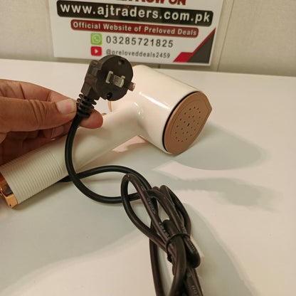 Portable handheld garment Iron